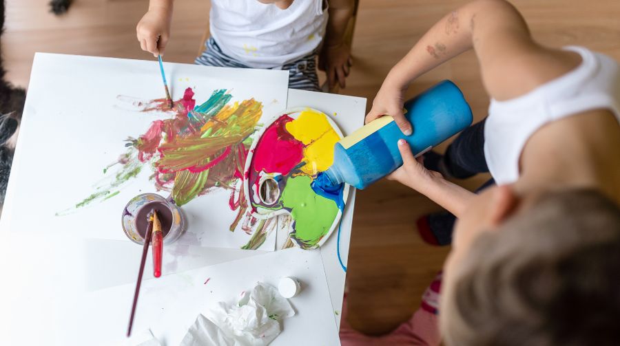 Children Mixing Paint: Encouraging Creativity and Color Exploration in Finger Painting for Dyslexic Kids